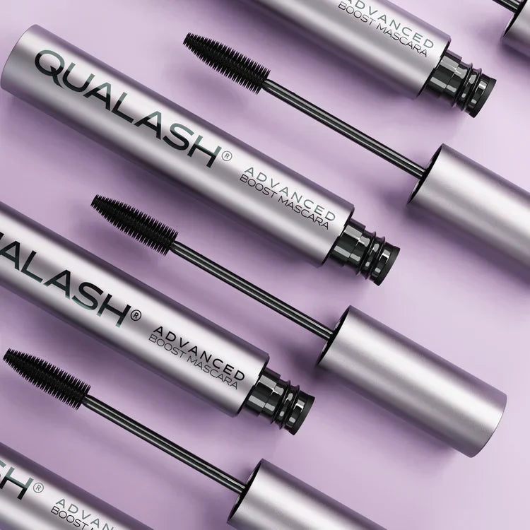 Close-up of open Qualash Peptide Lash Mascara on pastel background