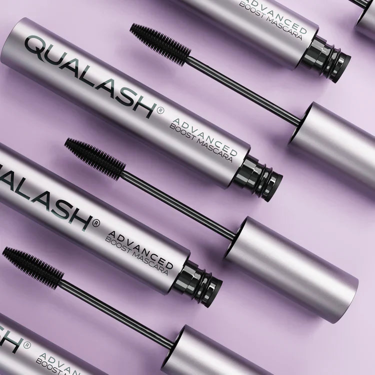 Close-up of open Qualash Peptide Lash Mascara on pastel background