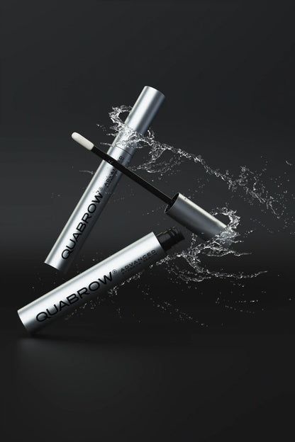 QUABROW Eyebrow Serum DUO SET shown with dynamic water splash effect on a black background