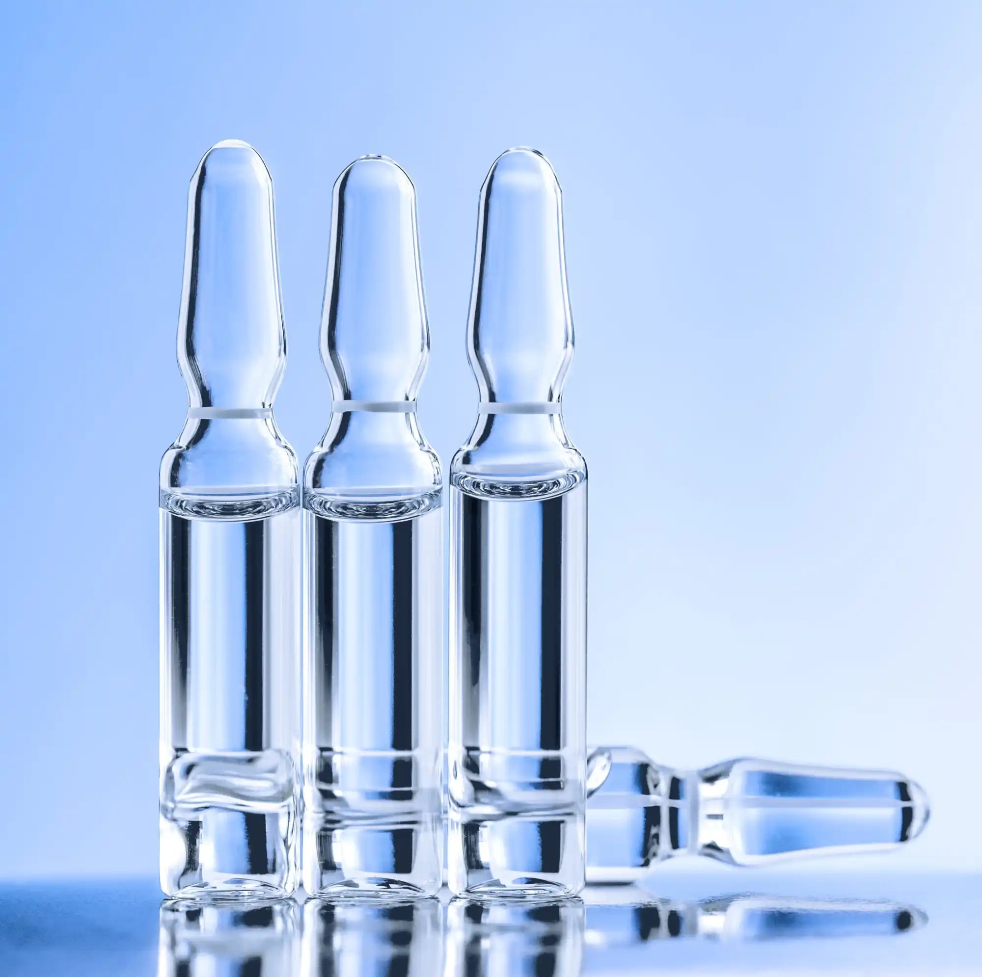 Glass ampoules containing clear liquid.